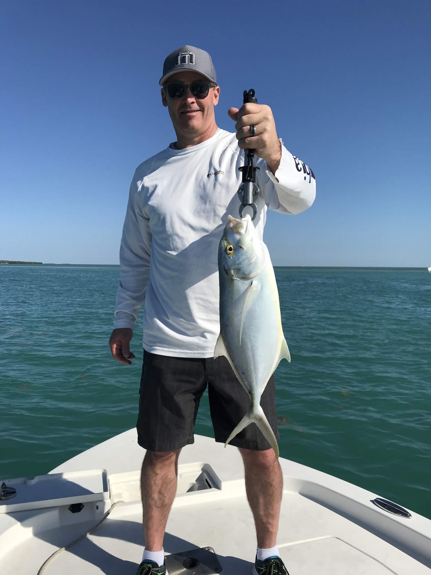 Man holding a yellow bar jack