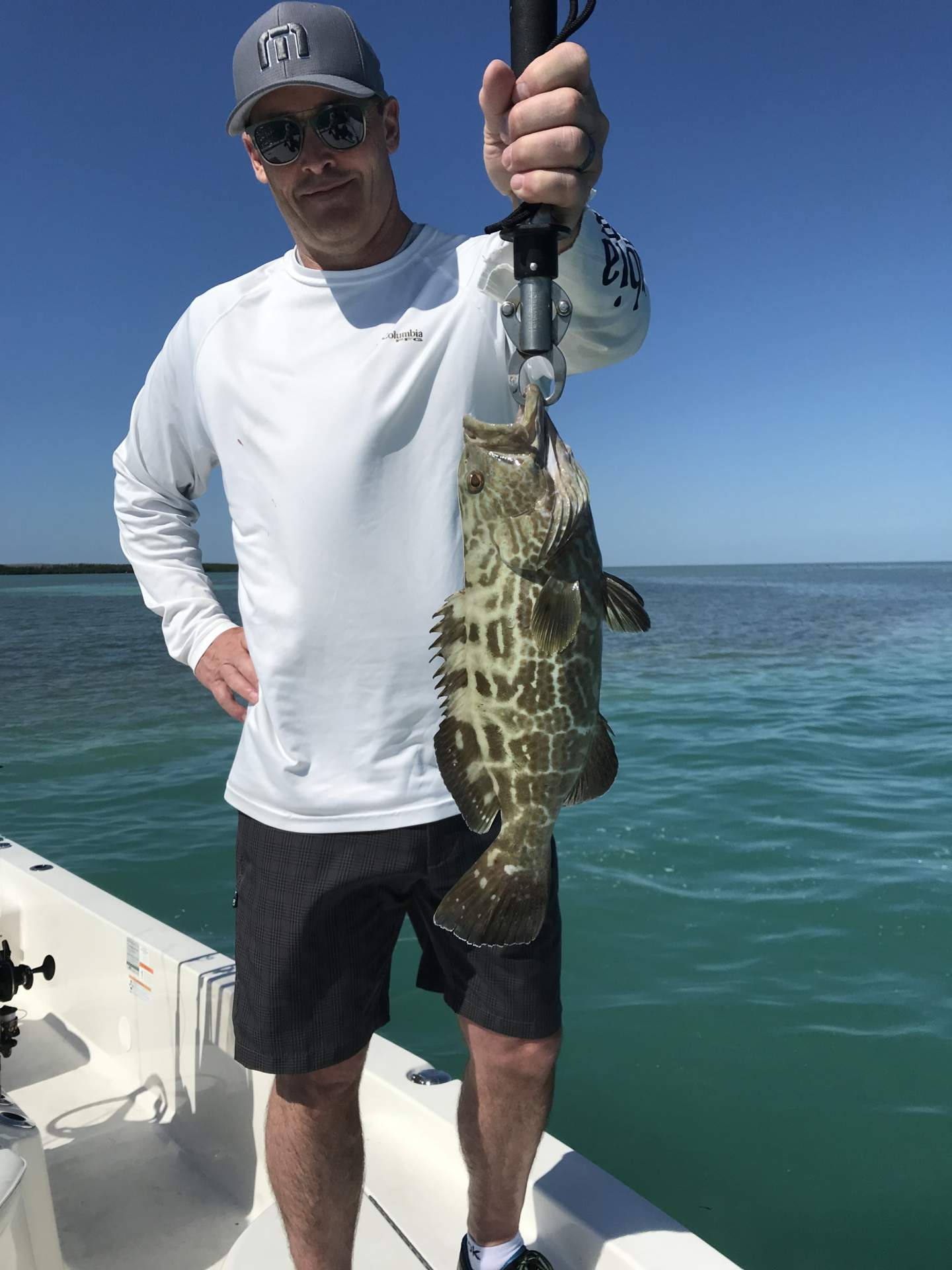 Man holding a grouper