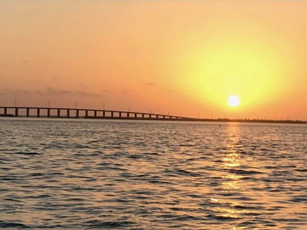 Sunset with bridge in background